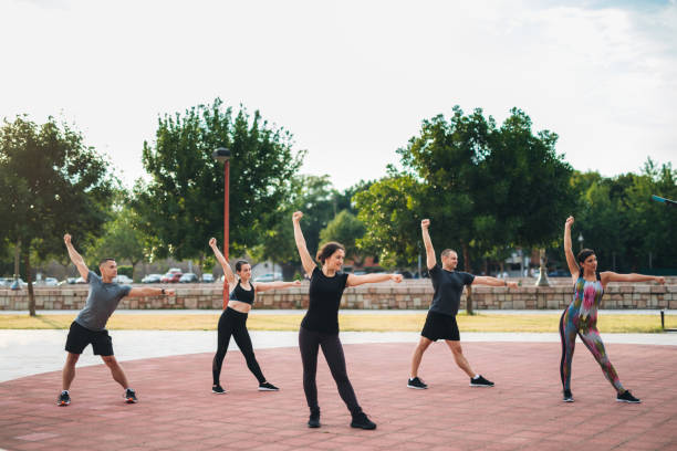 istock Group of Athletes Exercising Outdoors 1272552870