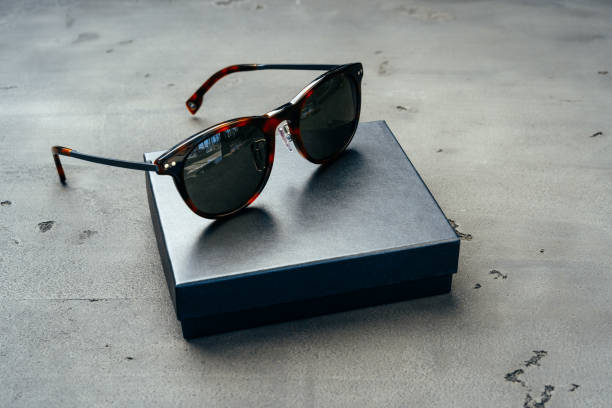 istock Dark male sunglasses on grey concrete surface 1272554215