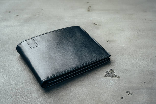 istock Black leather wallet on grey concrete background 1272554324
