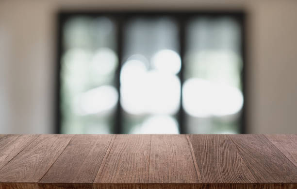istock Wood Table Top in Blur Background room interior with empty copy space. 1272555538
