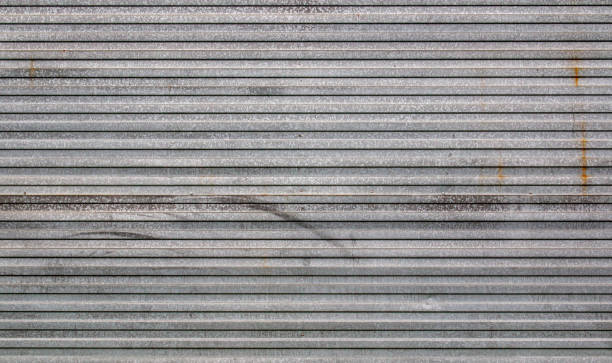 Background of galvanized corrugated tin iron with traces of rust and horizontal orientation