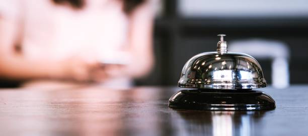 istock Hotel reception counter desk with service bell. 1272556013