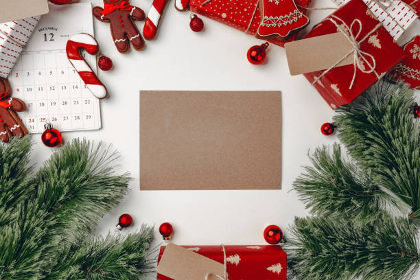 istock Christmas background with presents, coniferous branches and gingerbread cookie 1272559333
