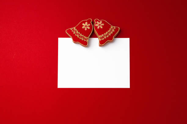 istock Blank paper and gingerbread Christmas cookie top view 1272559491