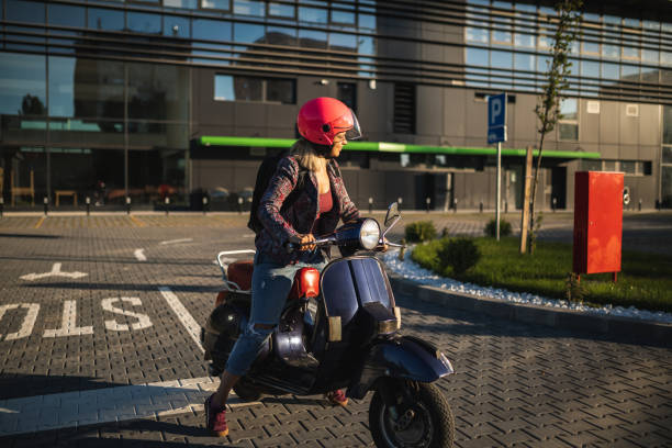 istock Beautiful young girl on scooter 1272561061