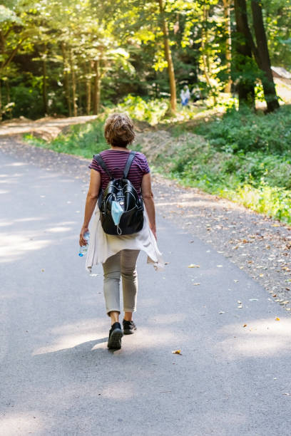 istock Woman walking in nature 1272564919