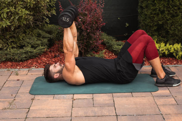 istock Muscular young man exercising in backyard 1272566359