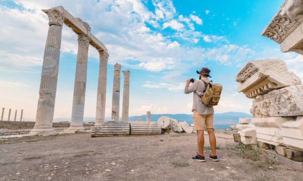 Traveller tourist photographer is taking photo in ancient ruins of Laodicea on the Lycus , Pamukkale UNESCO, Roman Empire, Camera, Laodikeia, Greek architecture ancient rome photos stock pictures, royalty-free photos & images