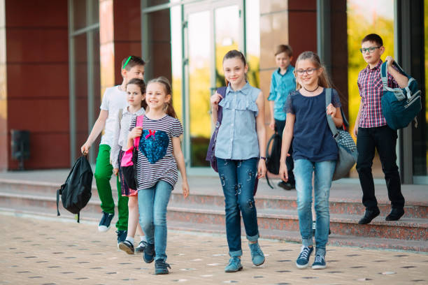 istock Group of kids going to school together. 1272567787