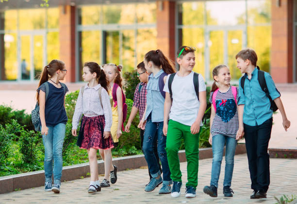 istock Group of kids going to school together. 1272567947