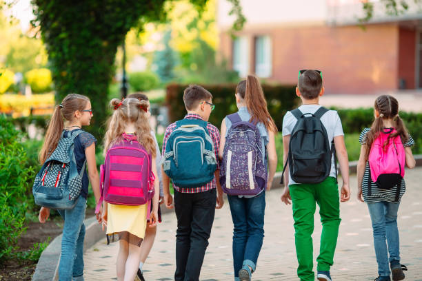 istock Group of kids going to school together. 1272568167