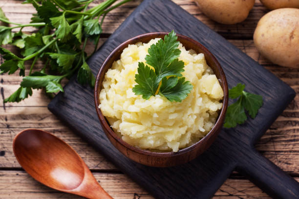 istock Homemade cream mashed potatoes in a dish with parsley. 1272569128