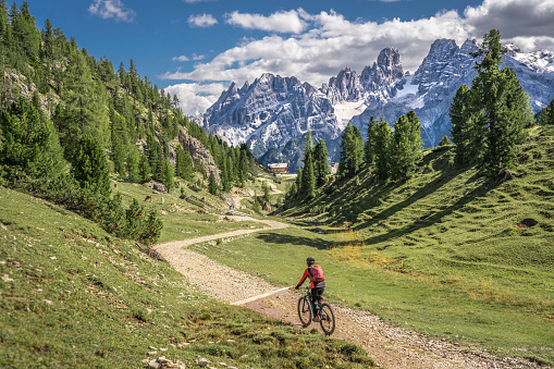 woman with elctric mountain bike in the Dolomites