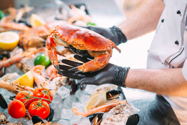 istock The Chef puts the seafood on a tray in the restaurant. 1272572087