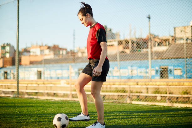 istock A female soccer player controlling a ball at a training. 1272572525