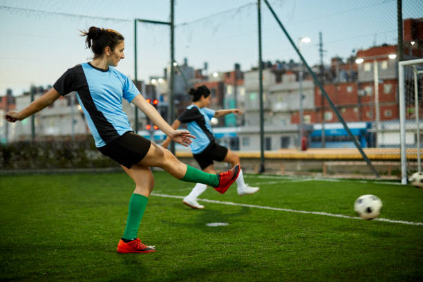 istock A female soccer player striking a goal at a training session. 1272572536