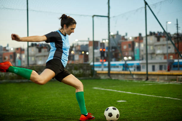 istock A female soccer player striking a goal at a training session. 1272572541