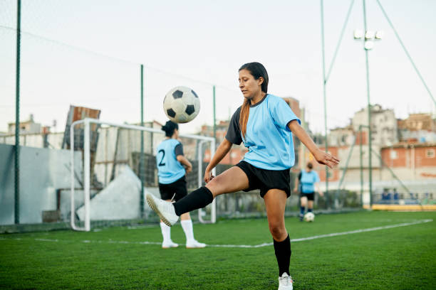 istock A female soccer player controlling a ball at a training. 1272572543