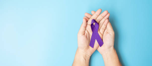 Pancreatic Cancer, world Alzheimer, epilepsy, lupus and domestic violence day Awareness month, Woman holding purple Ribbon for supporting people living. Healthcare and World cancer day concept Pancreatic Cancer, world Alzheimer, epilepsy, lupus and domestic violence day Awareness month, Woman holding purple Ribbon for supporting people living. Healthcare and World cancer day concept february photos stock pictures, royalty-free photos & images