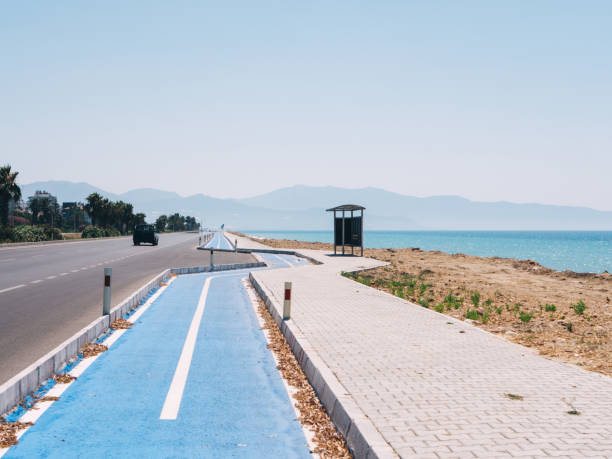 istock Highway road with bicycle road going by the sea 1272577027