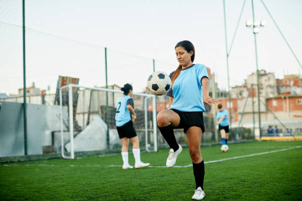 istock A female soccer player controlling a ball at a training. 1272577200