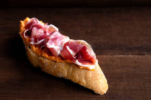 istock Serrano ham toast with salmorejo. Horizontal wooden background 1272577293