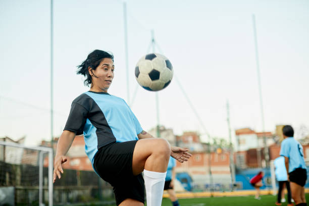 istock A female soccer player controlling a ball at a training. 1272577606