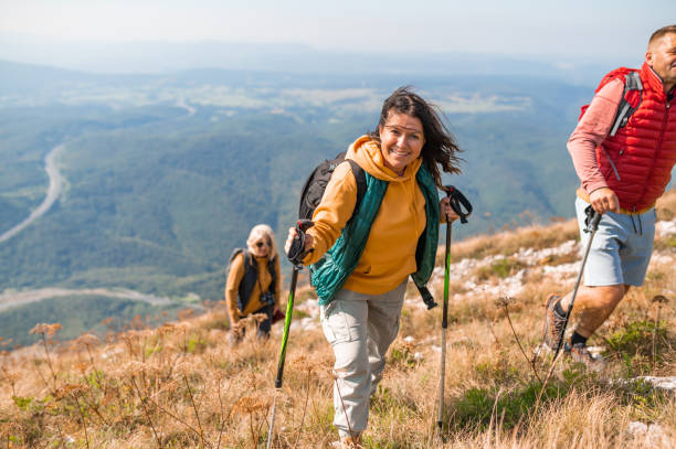 istock Small group of people hiking in mountains 1272579090