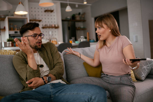 istock Boyfriend and girlfriend are arguing on the couch. 1272579849