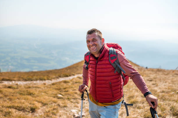 istock Adult man hiking in mountain range 1272579880