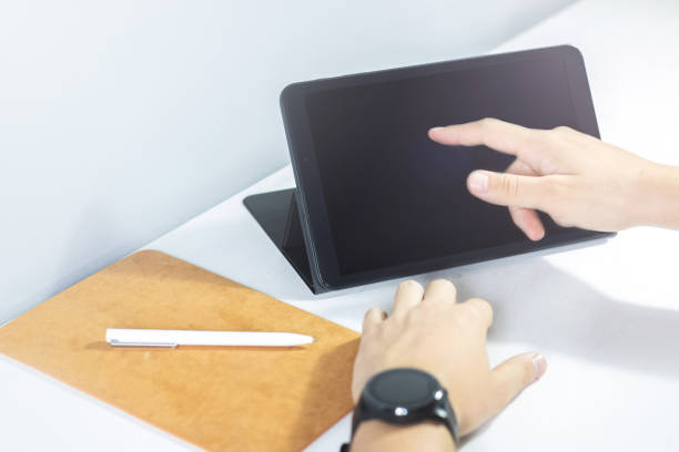 istock Workspace with a tablet and a pen to work from home or office 1272580506