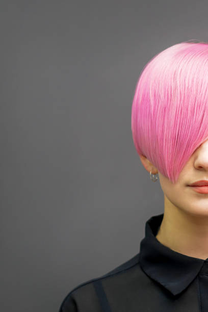 istock Woman with short bright pink hair 1272580556