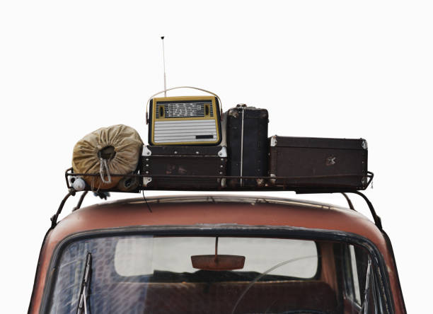 istock retro car with suitcases on roof 1272581661