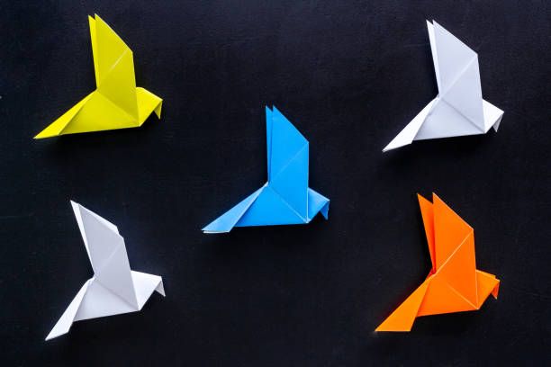 istock Paper pigeons in origami technique. DIY creativity. View from above 1272581687