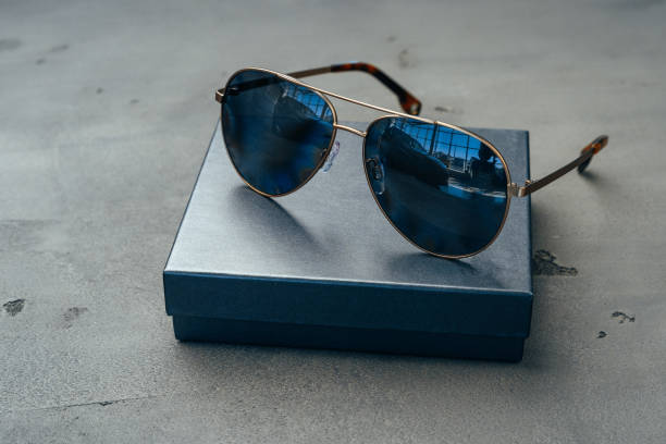 istock New dark aviator glasses on grey concrete background 1272584175