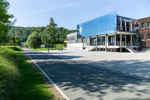 Gera, Germany - September 15. 2020 - The Hofwiesenbad is a public indoor swimming pool with a 25m pool in which competitions are also held. It is located in the middle of the picturesque Hofwiesenpark below Osterstein Castle. Many people go for a walk on the banks of the river Weiße Elster