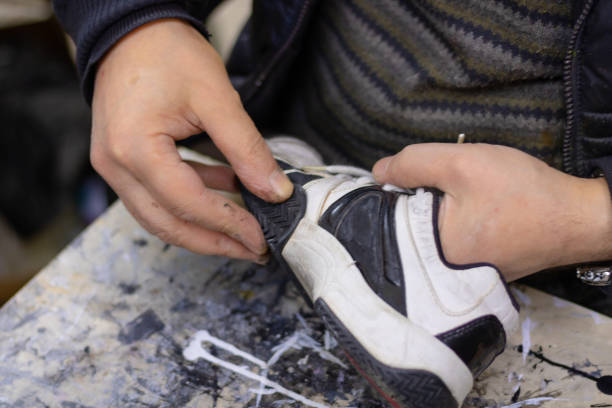 istock Man repairing a shoe 1272584469