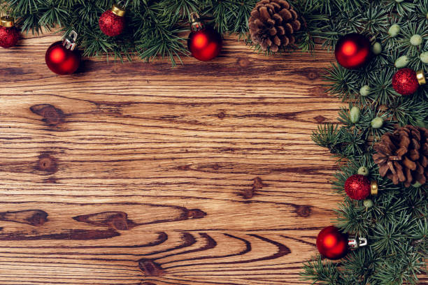 istock Christmas background with decorations on brown wooden board 1272585243