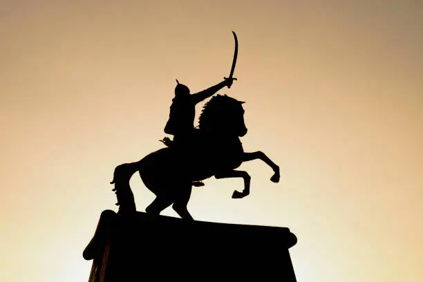 silhouette of warrior man on horse;depicting the free, combative and strong human model