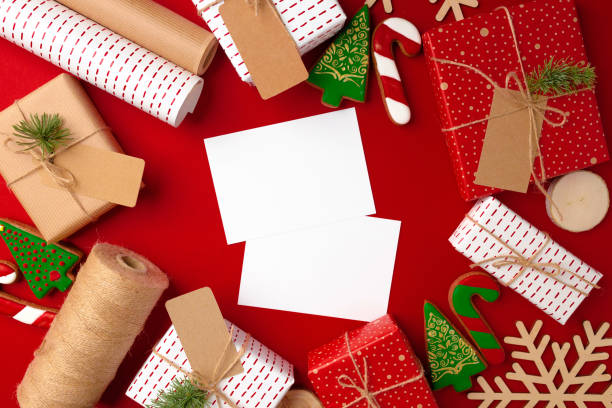 istock Christmas preparations concept with wrapping paper, gift boxes on red background 1272585887