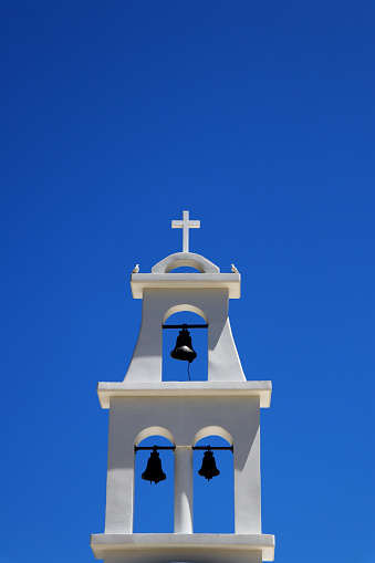 Bell tower of a greek church - clear blue sky