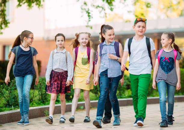 istock Group of kids going to school together. 1272586519
