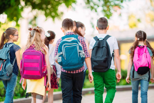 istock Group of kids going to school together. 1272586527