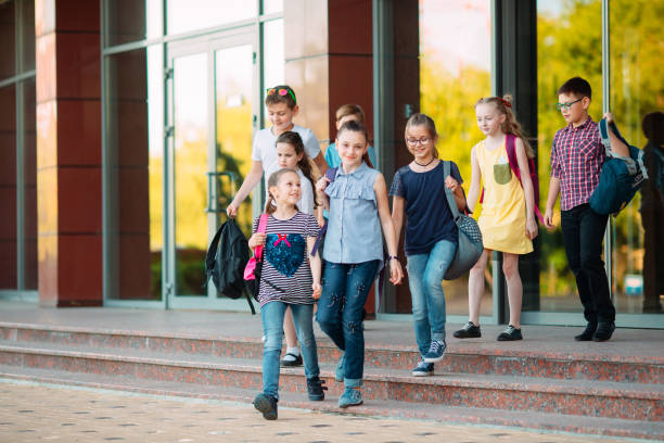 istock Group of kids going to school together. 1272586600