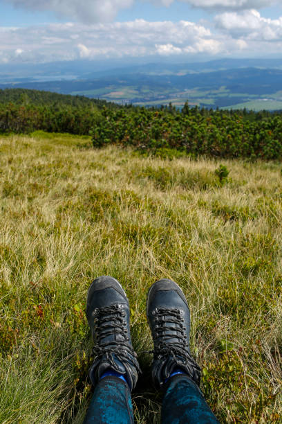 istock women hiker boots on the mountain peak 1272586745