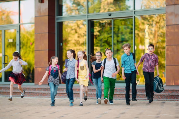 istock Group of kids going to school together. 1272586759