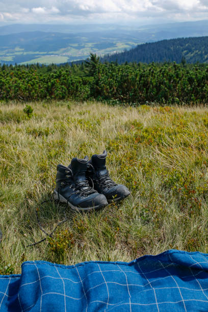 istock hiker boots and blanket in the mountain 1272586783