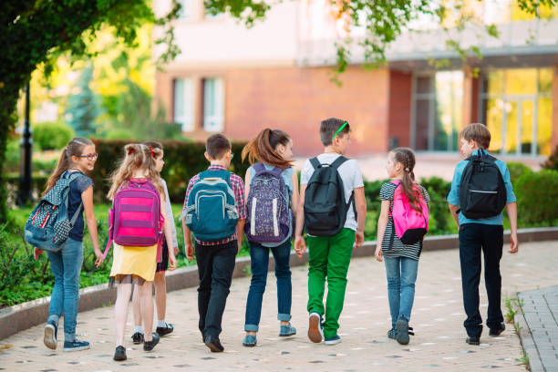 istock Group of kids going to school together. 1272586969