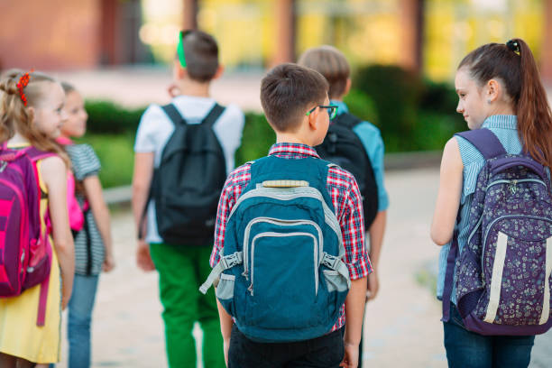 istock Group of kids going to school together. 1272587036