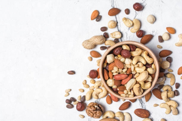 istock Bowl with almond, hazelnut, walnut, peanut, cashew and pine nuts 1272589630